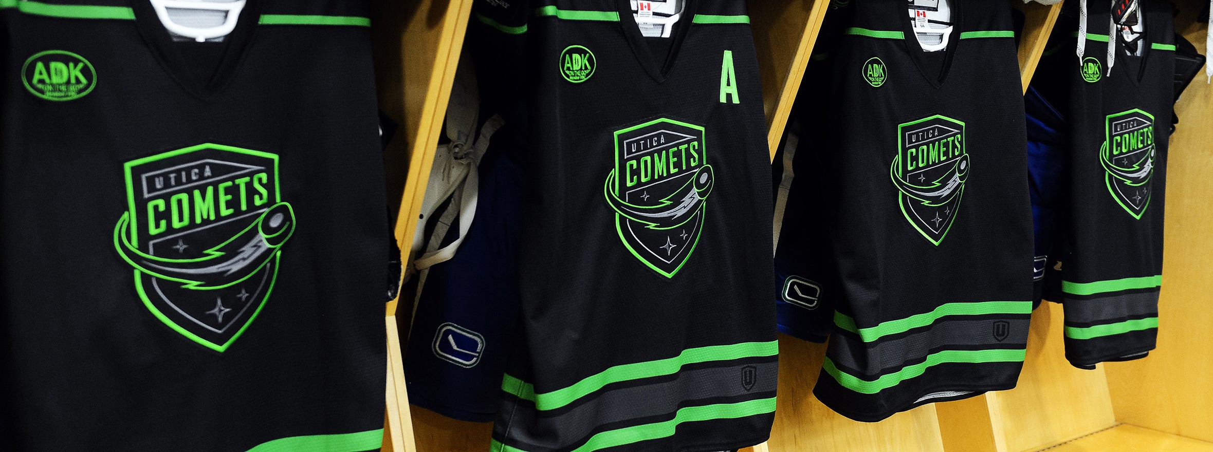 utica comets black jersey